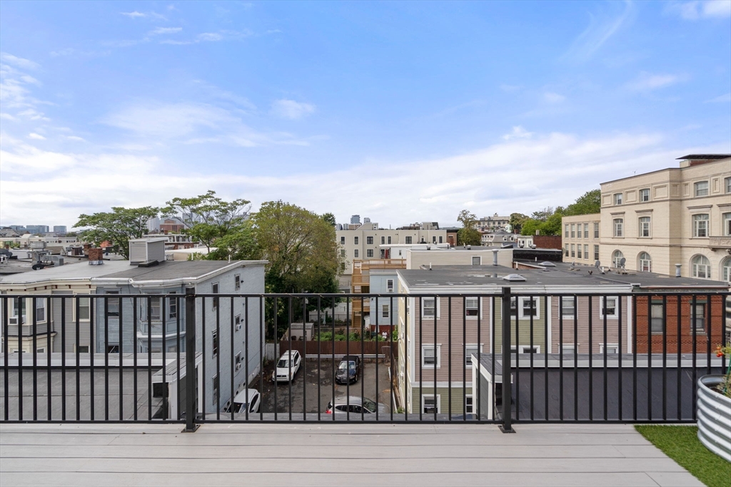 152 Marion Street, Unit 6L Boston, MA 02128 - Photo 20 of 22 a view of city from a balcony