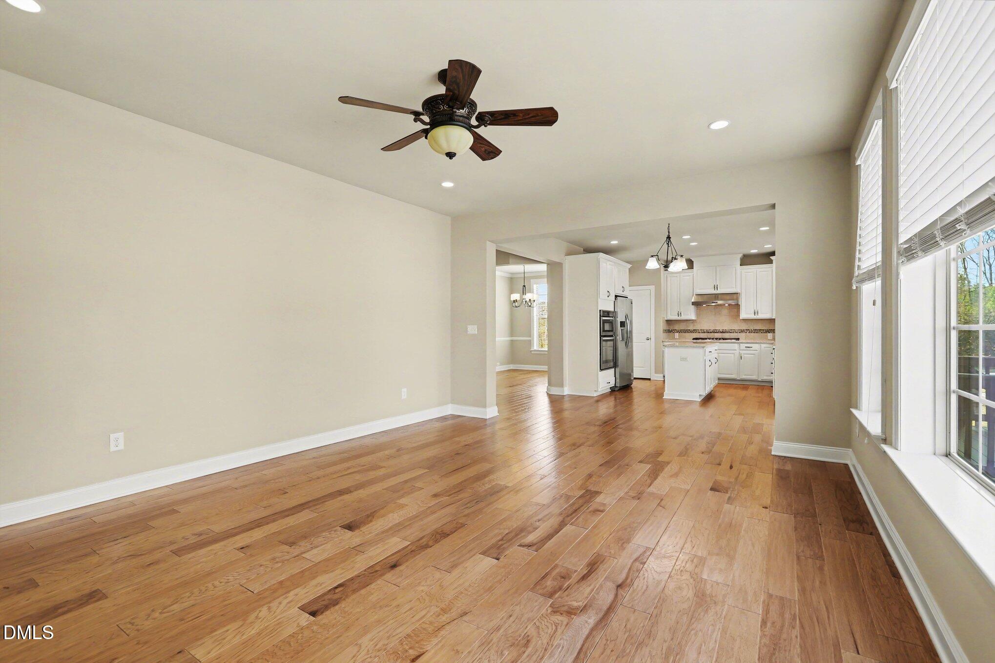 351 Gartrell Way Cary, NC 27519 - Photo 15 of 51 a view of empty room with wooden floor and window