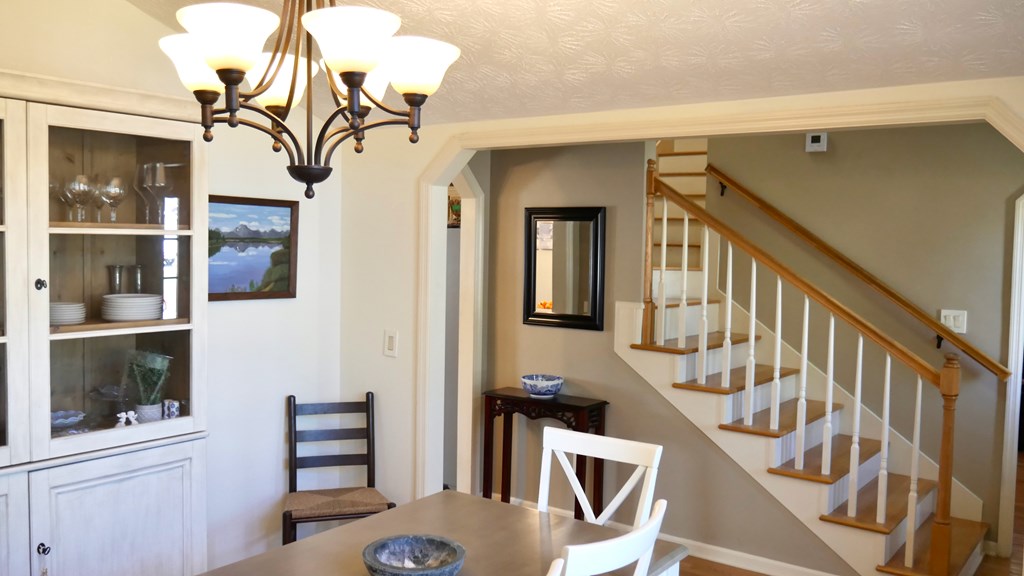 43 Chive Court Columbus, GA 31909 - Photo 10 of 37 a view of a hallway with wooden floor and staircase