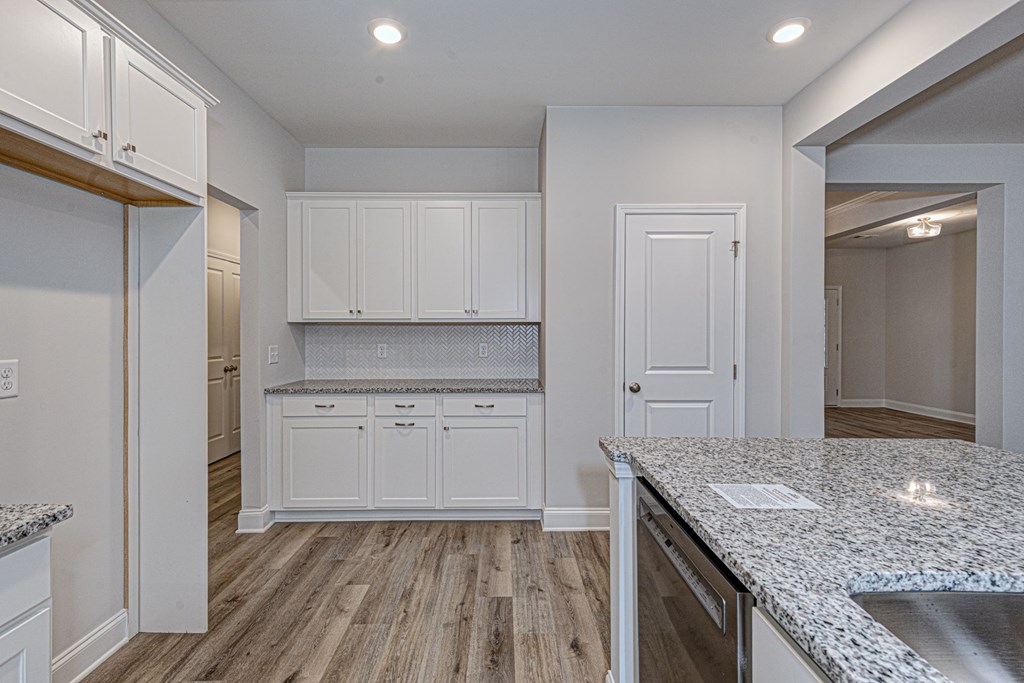 8711 McKee Road Upatoi, GA 31829 - Photo 16 of 45 a kitchen with a sink stove and refrigerator