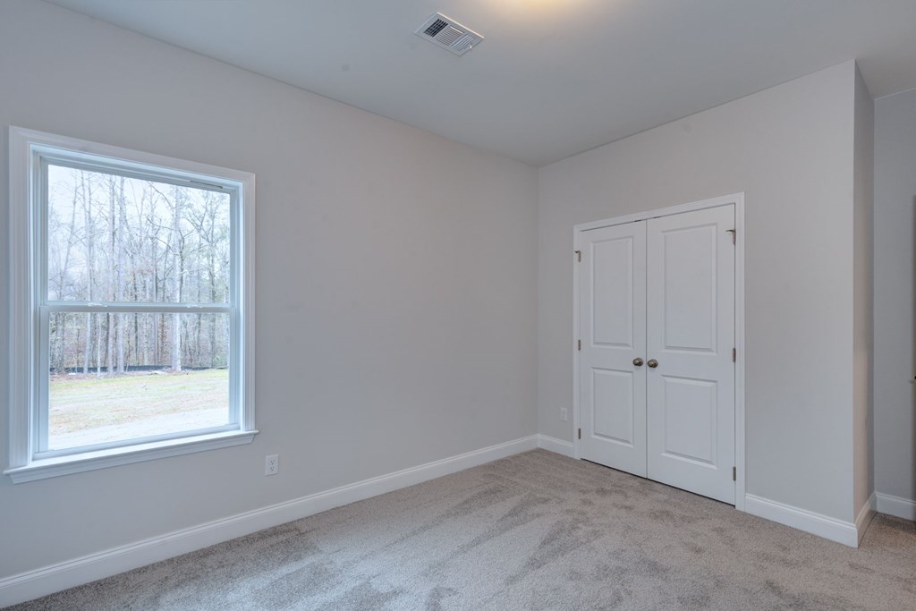 8711 McKee Road Upatoi, GA 31829 - Photo 20 of 45 an empty room with a window