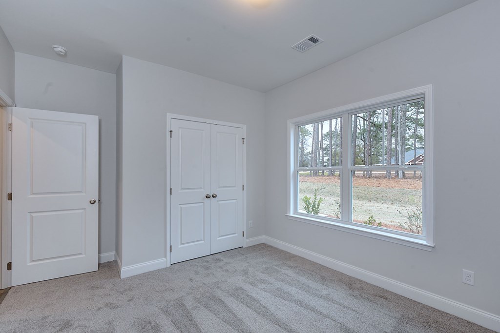 8711 McKee Road Upatoi, GA 31829 - Photo 23 of 45 a view of an empty room with a window