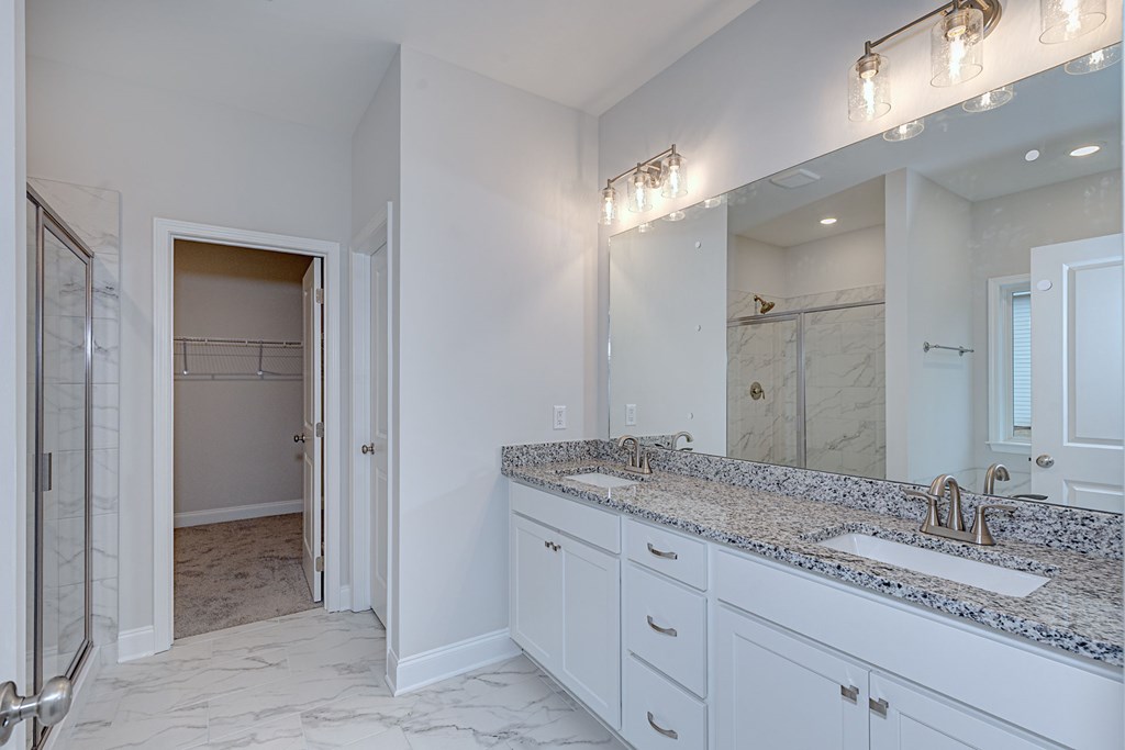 8711 McKee Road Upatoi, GA 31829 - Photo 28 of 45 a bathroom with a granite countertop sink and a mirror