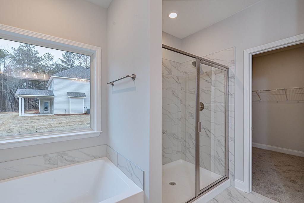 8711 McKee Road Upatoi, GA 31829 - Photo 31 of 45 a bathroom with a glass shower door