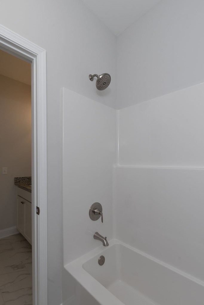 8711 McKee Road Upatoi, GA 31829 - Photo 40 of 45 a bathroom with a bathtub