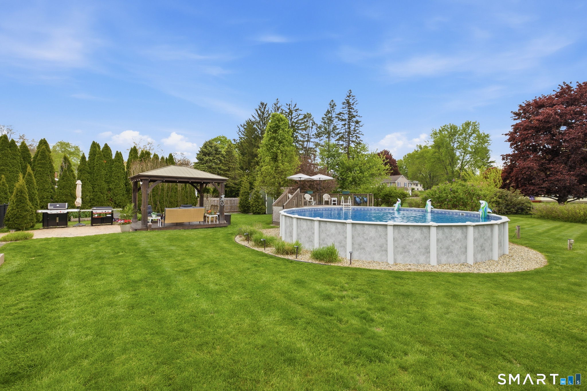 7 Stardust Drive Enfield, CT 06082 - Photo 31 of 38 a view of a house with a backyard