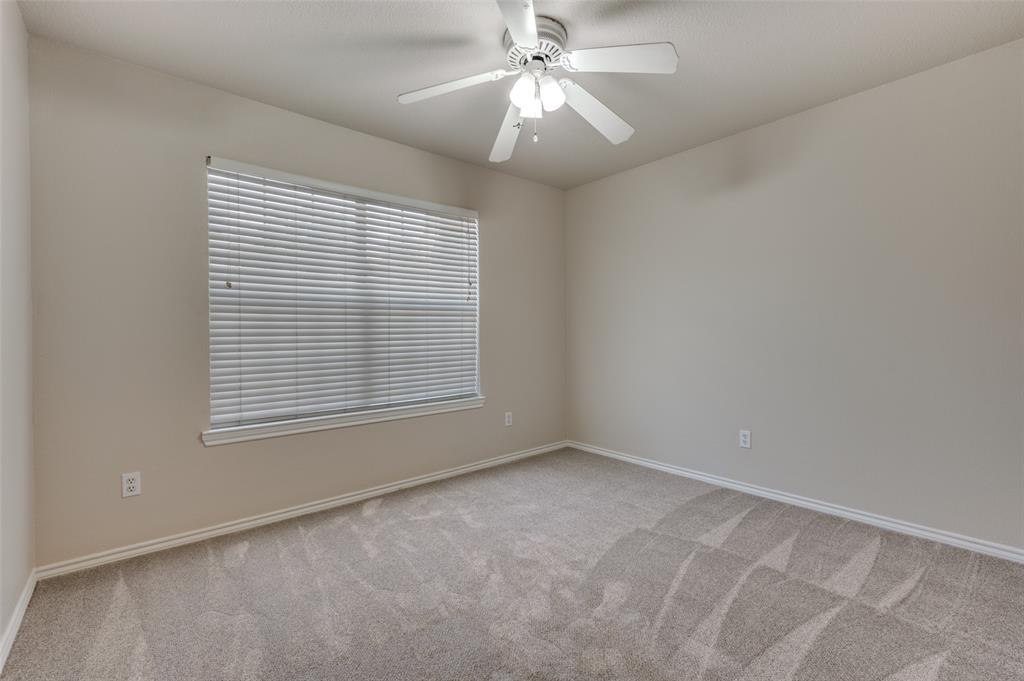 2606 Whetstone Drive Corinth, TX 76210 - Photo 13 of 28 a view of an empty room with a window