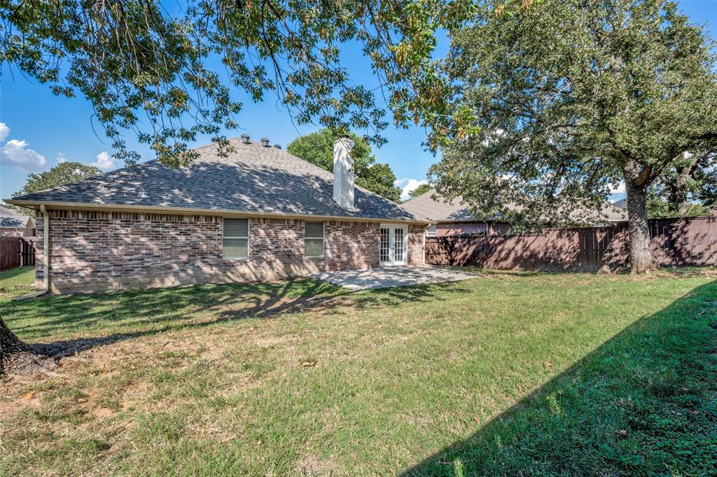 2606 Whetstone Drive Corinth, TX 76210 - Photo 24 of 28 a view of backyard with green space