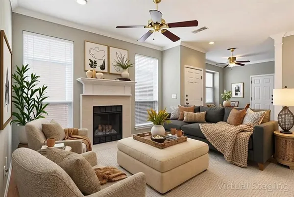 a living room with furniture and a fireplace