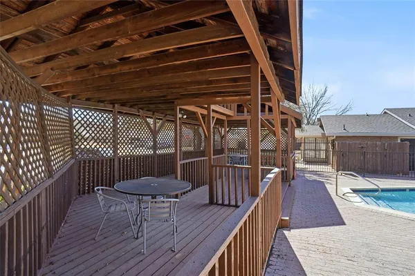 a view of outdoor space with wooden floor and seating space