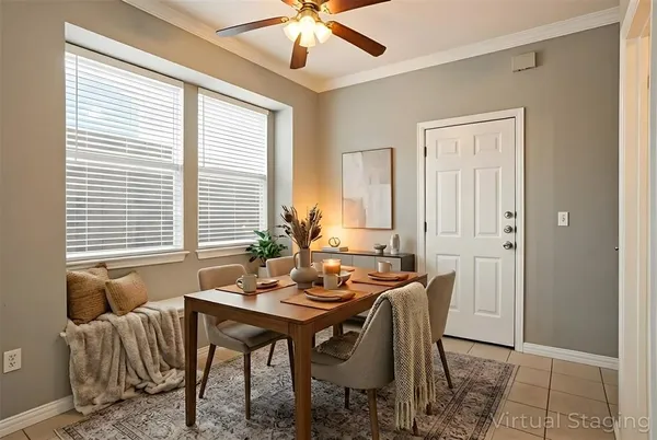 a dining room with furniture and window