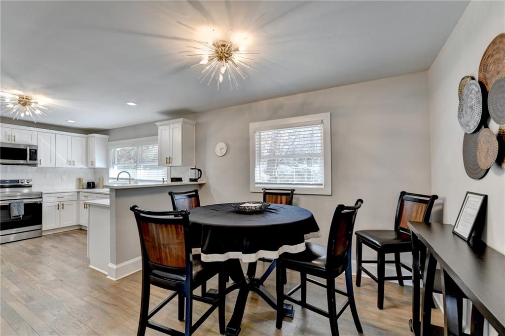 2945 Monterey Drive Decatur, GA 30032 - Photo 18 of 93 a view of a dining room with furniture and a chandelier