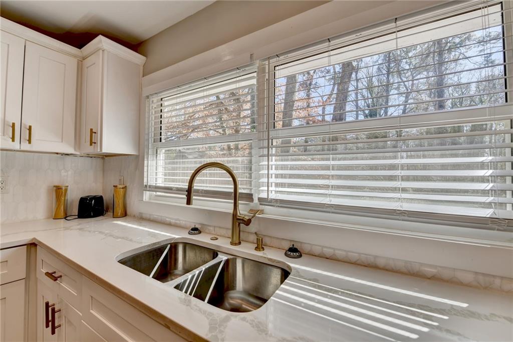 2945 Monterey Drive Decatur, GA 30032 - Photo 28 of 93 a kitchen with a sink cabinets and a window