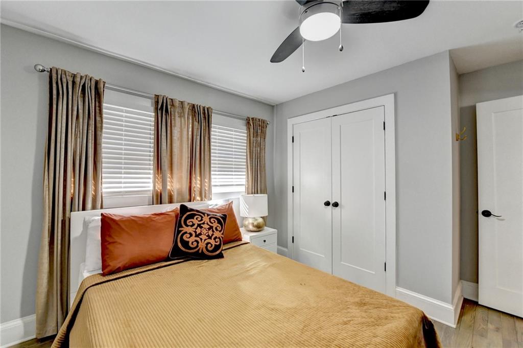 2945 Monterey Drive Decatur, GA 30032 - Photo 37 of 93 a bedroom with a bed and a chandelier