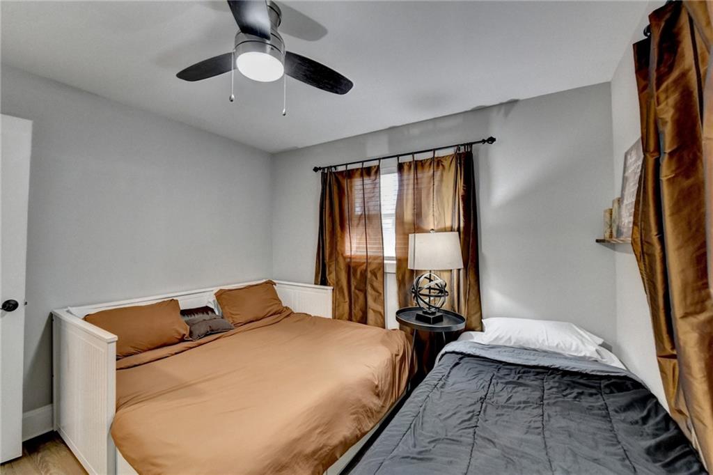 2945 Monterey Drive Decatur, GA 30032 - Photo 41 of 93 a bedroom with a bed and a chandelier