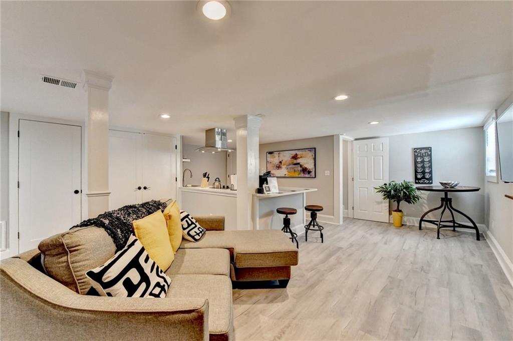 2945 Monterey Drive Decatur, GA 30032 - Photo 68 of 93 a living room with furniture and a wooden floor