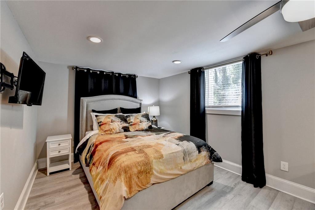 2945 Monterey Drive Decatur, GA 30032 - Photo 75 of 93 a bedroom with a bed and flat tv screen on the dresser