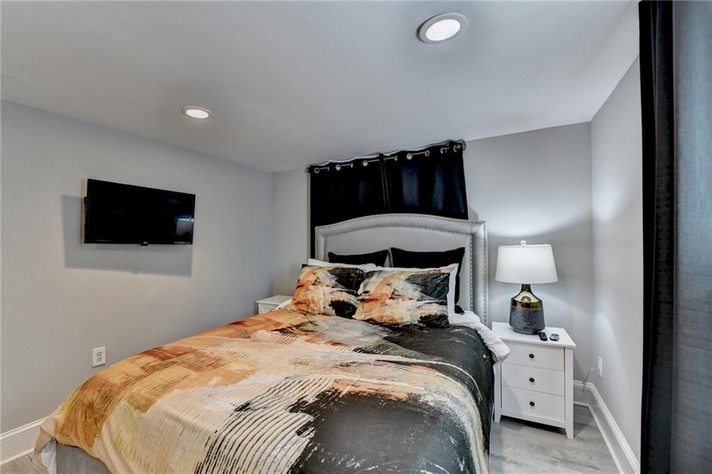 2945 Monterey Drive Decatur, GA 30032 - Photo 77 of 93 a bedroom with a bed and tv