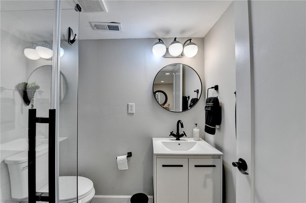 2945 Monterey Drive Decatur, GA 30032 - Photo 82 of 93 a bathroom with a sink and a mirror