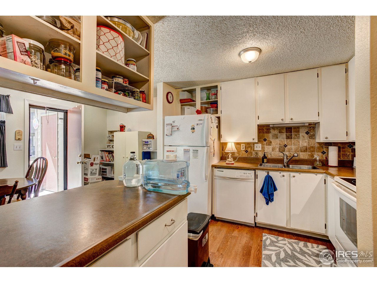 925 Columbia Road, Unit 113 Fort Collins, CO 80525 - Photo 8 of 20 Open concept kitchen and dining area