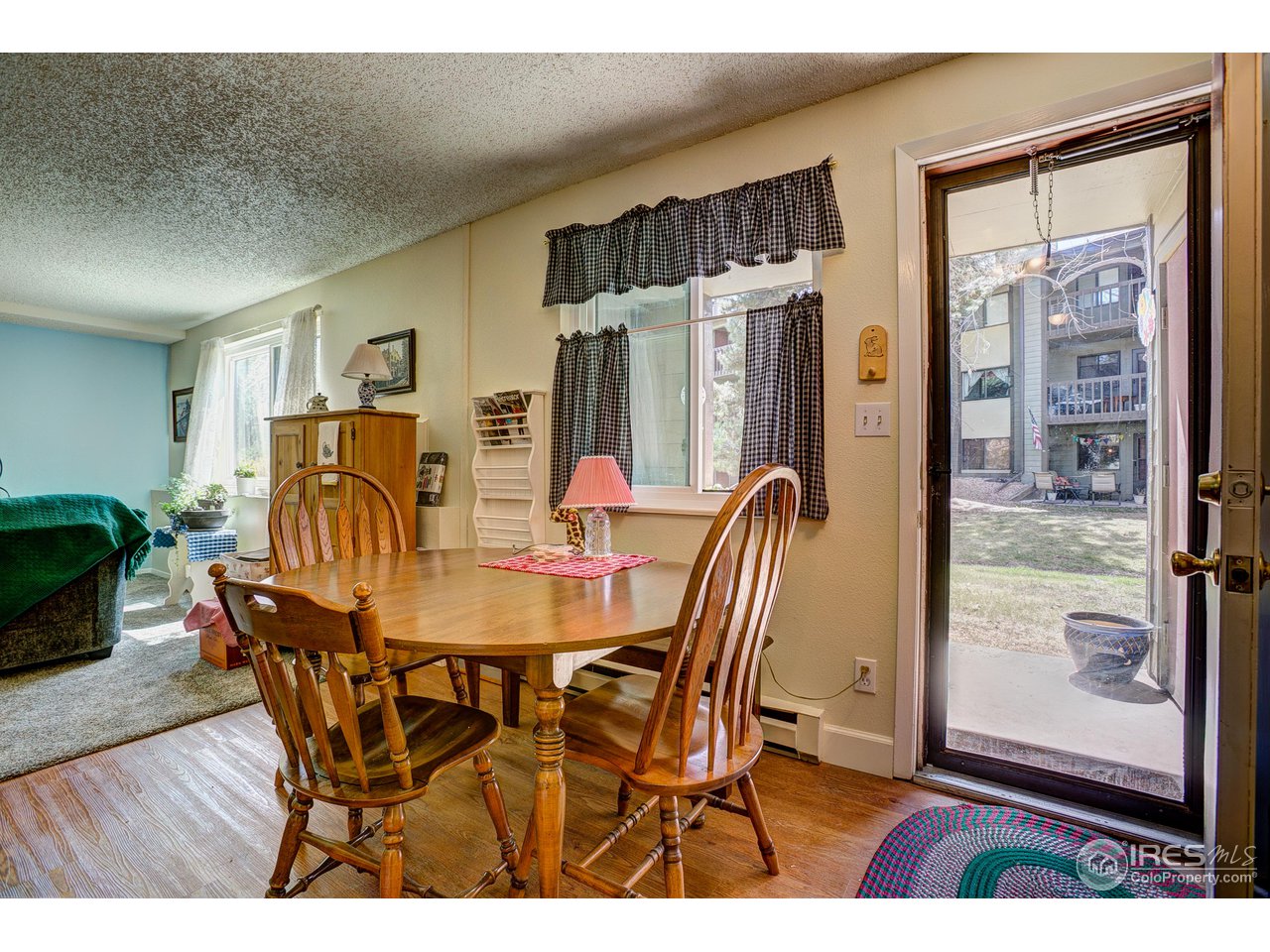 925 Columbia Road, Unit 113 Fort Collins, CO 80525 - Photo 10 of 20 Dining room leads to back patio