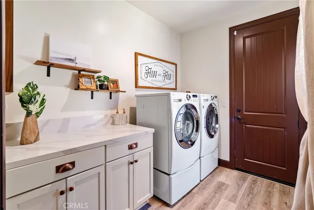 a bathroom with double vanity sink and a mirror