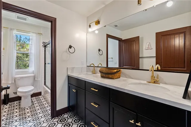 a living room with furniture and a lamp