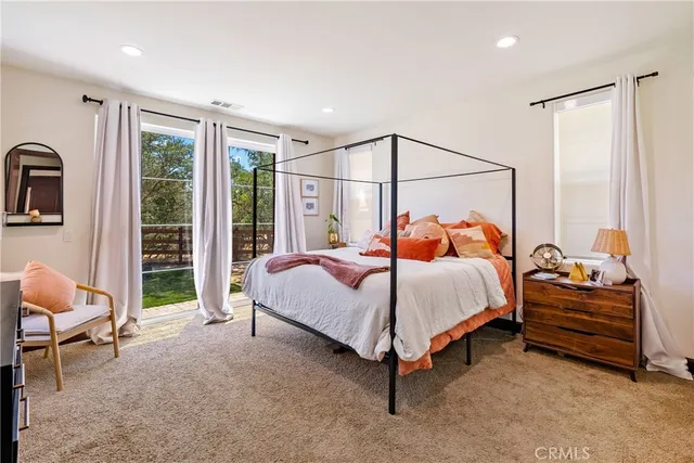 a view of living room with furniture and wooden floor