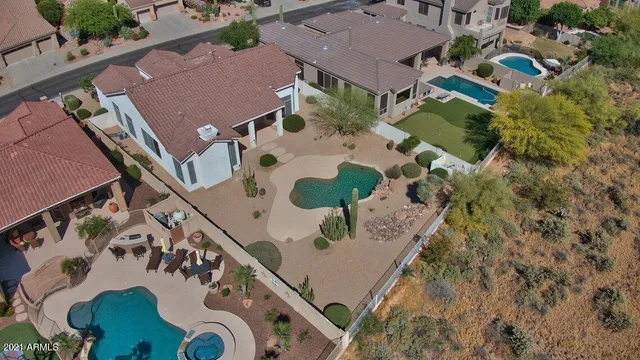 an aerial view of a house swimming pool