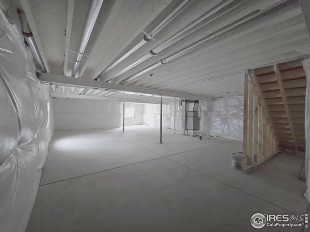 a view of empty room with stairs