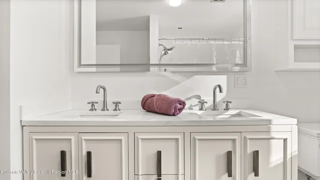 a bathroom with a toilet a sink and a window