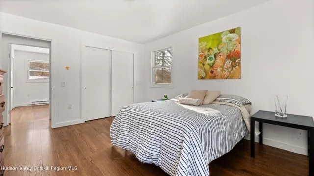 a bedroom with a bed and a desk