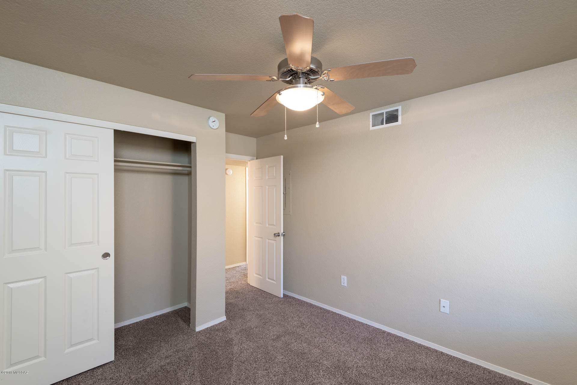 7255 East Snyder Road, Unit 8205 Tucson, AZ 85750 - Photo 13 of 23 wooden floor in an empty room