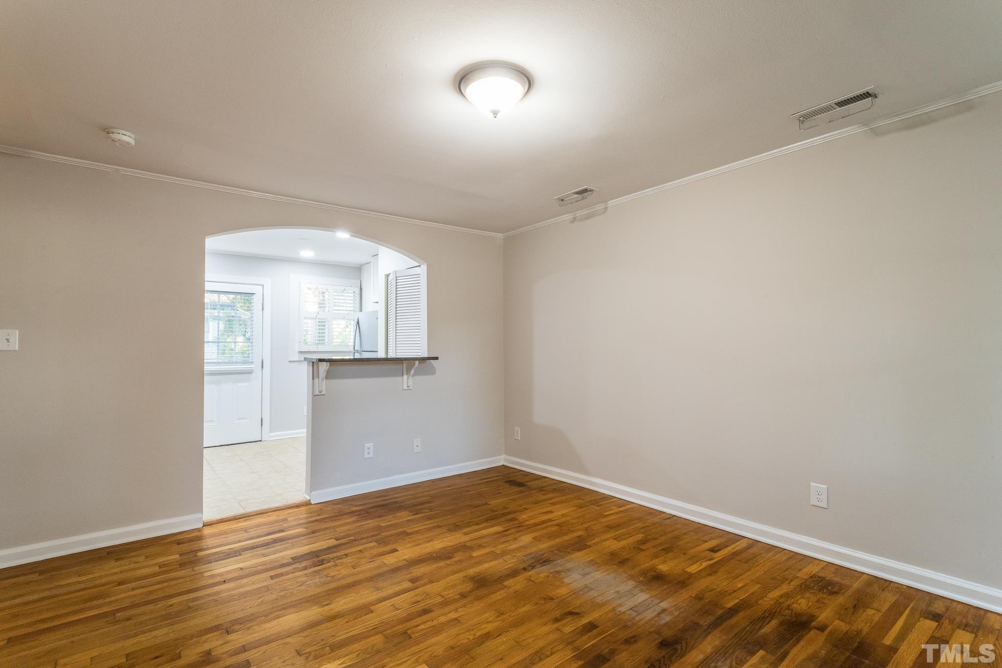 2620 McNeil Street, Unit 2620 Raleigh, NC 27608 - Photo 11 of 23 a view of empty room with wooden floor