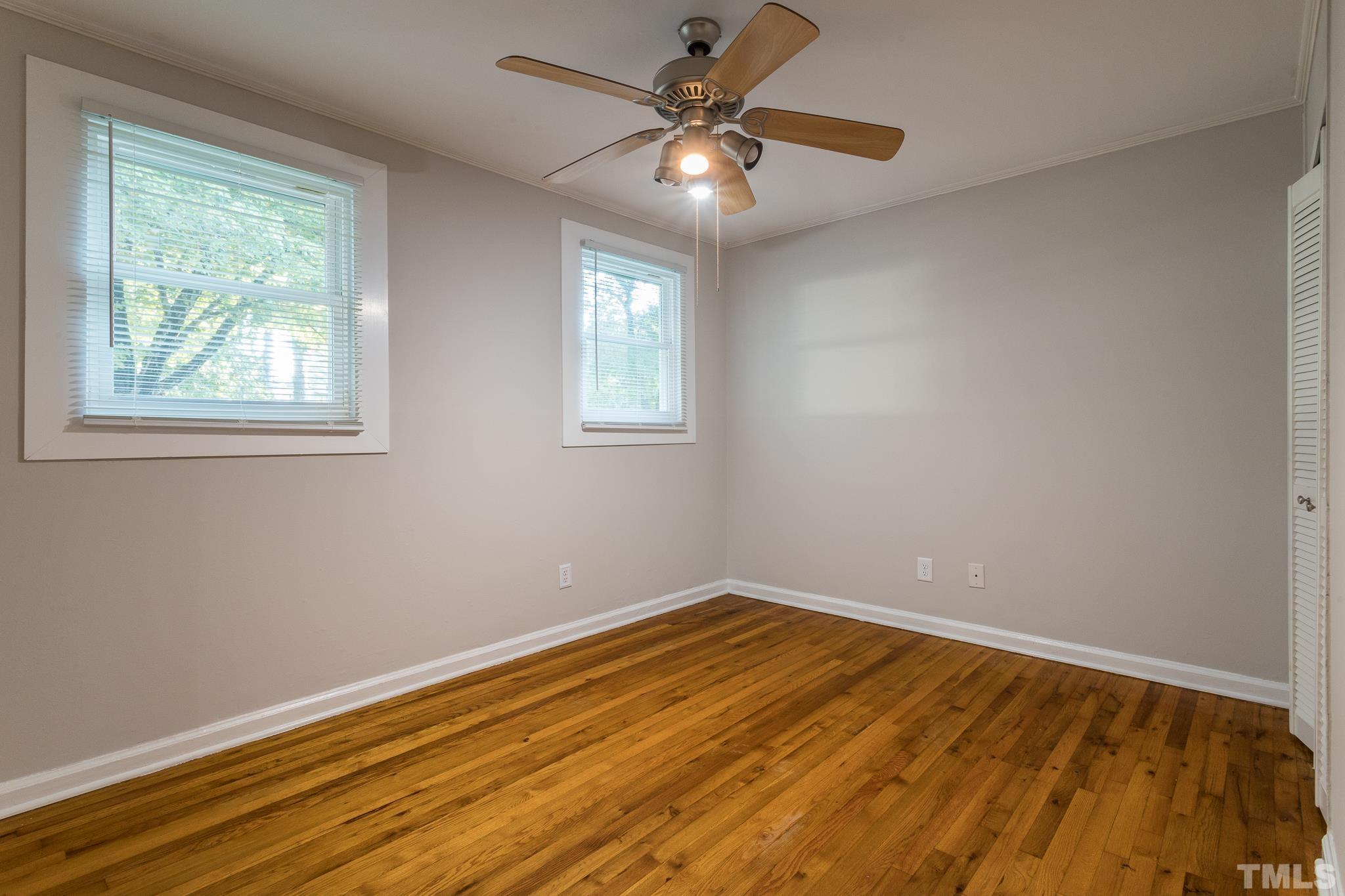 2620 McNeil Street, Unit 2620 Raleigh, NC 27608 - Photo 15 of 23 wooden floor in an empty room with a window
