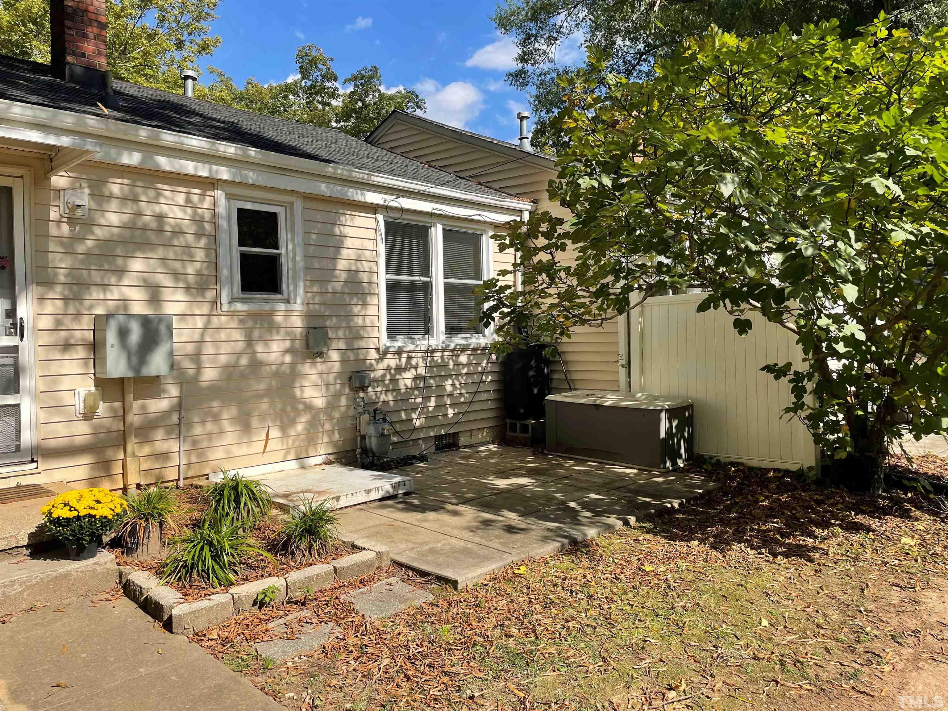 2620 McNeil Street, Unit 2620 Raleigh, NC 27608 - Photo 20 of 23 a view of a house with a yard