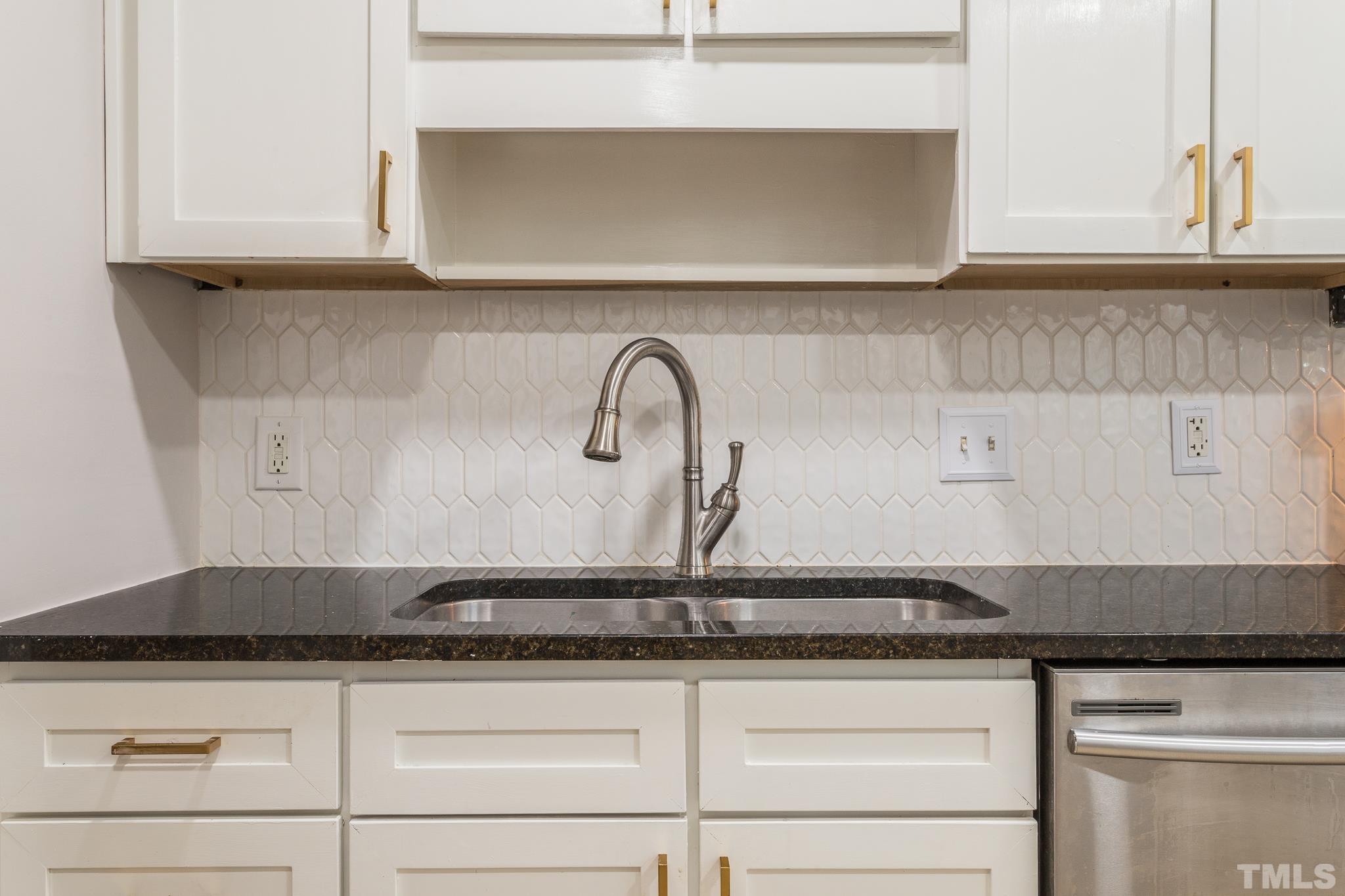2620 McNeil Street, Unit 2620 Raleigh, NC 27608 - Photo 5 of 23 a close view of sink and tap