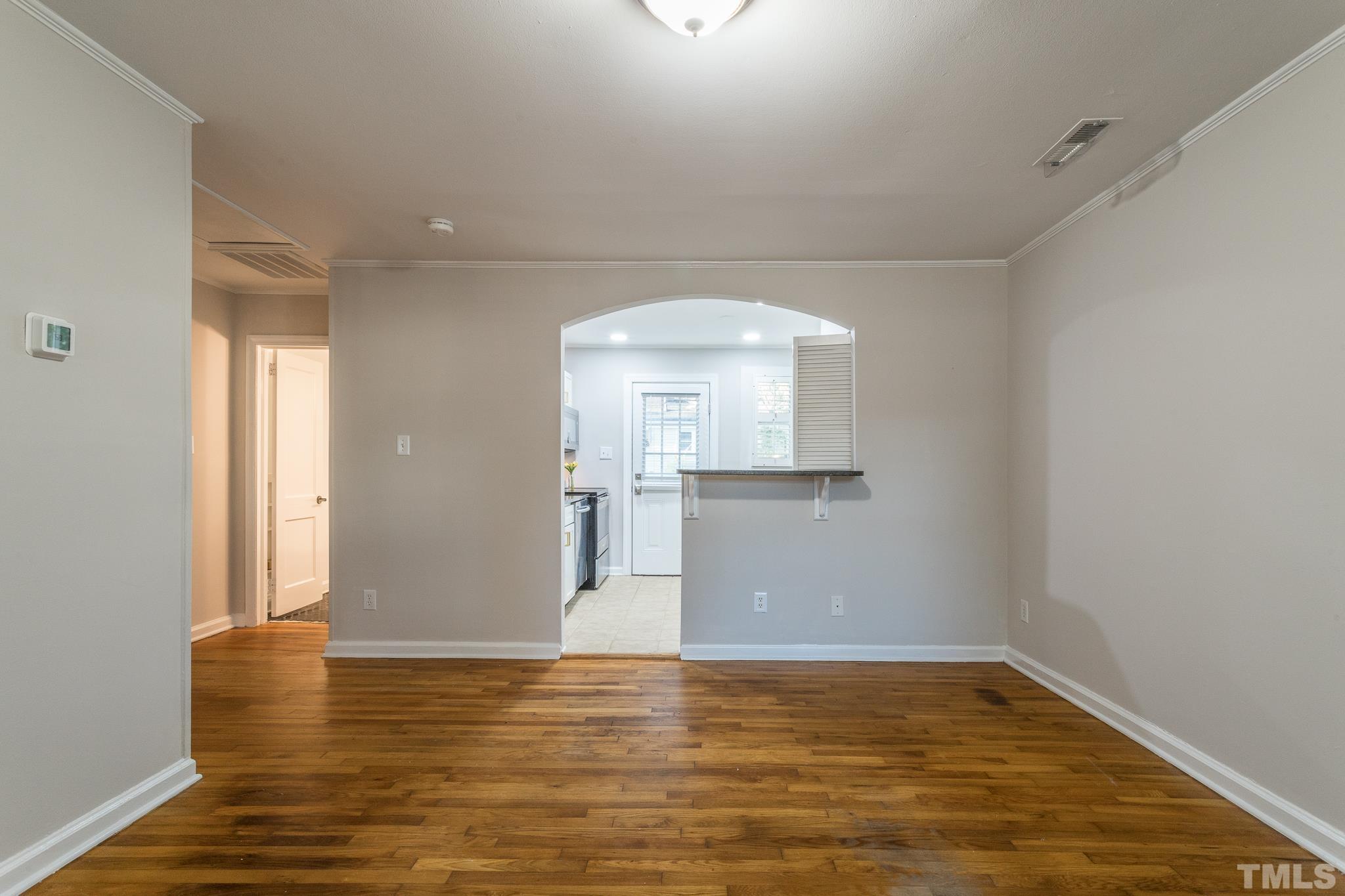 2620 McNeil Street, Unit 2620 Raleigh, NC 27608 - Photo 10 of 23 a view of empty room with wooden floor and fan