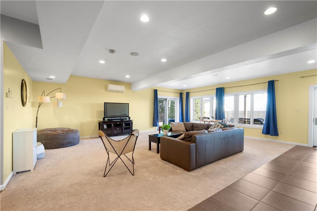 806 Harmony Road Pittsburgh, PA 15237 - Photo 34 of 49 Bright lower level family room with access to the yard and pool.