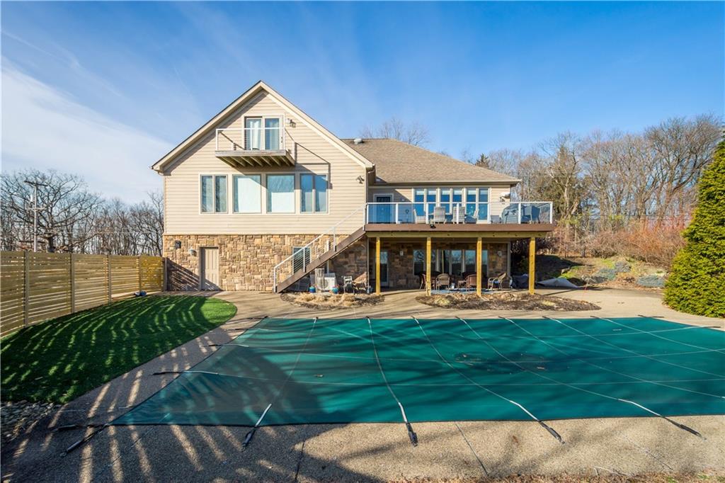 806 Harmony Road Pittsburgh, PA 15237 - Photo 40 of 48 Rear view of house showing balcony, decks and fenced yard area.