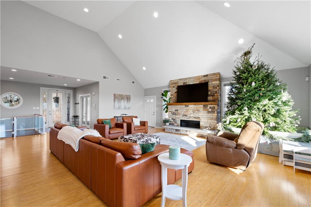 806 Harmony Road Pittsburgh, PA 15237 - Photo 6 of 48 Stone and wood hearth surround the gas fireplace.