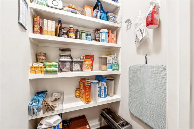 a shelf with books and knick knacks on it