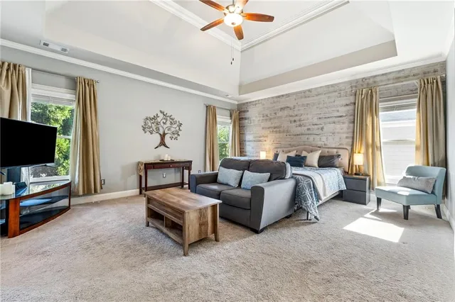 a bedroom with furniture and a flat screen tv