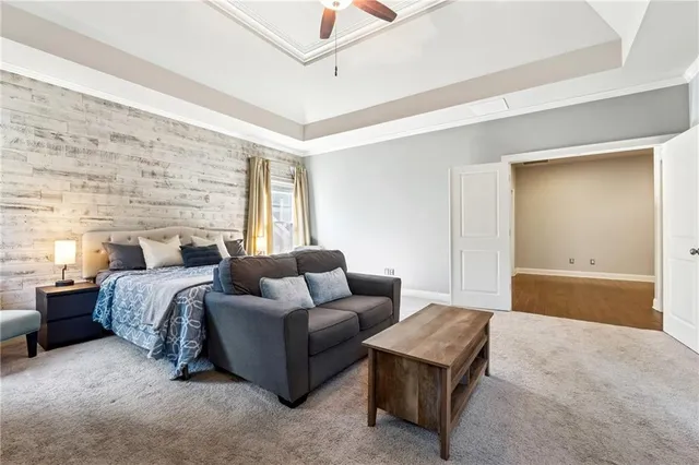 a bedroom with a bed and a couch