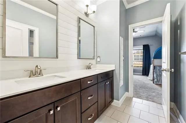 a bathroom with a sink double vanity and a mirror