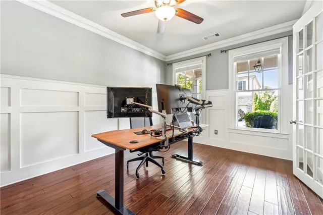 a workspace with furniture window and wooden floor