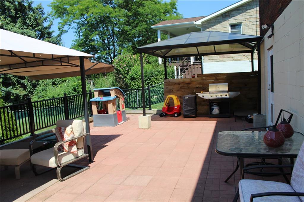 1957 Brodhead Road Aliquippa, PA 15001 - Photo 17 of 19 Second canopy also stays. Perfect for addition seating, or cooking. Fully fenced in yard will allow the children and pets safe from venturing off.
