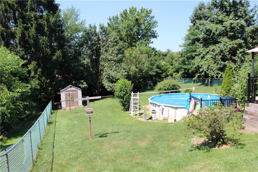 1957 Brodhead Road Aliquippa, PA 15001 - Photo 18 of 19 Fully fenced in backyard, above ground swimming pool you will love. Storage shed for the lawn equipment is set back in the yard.