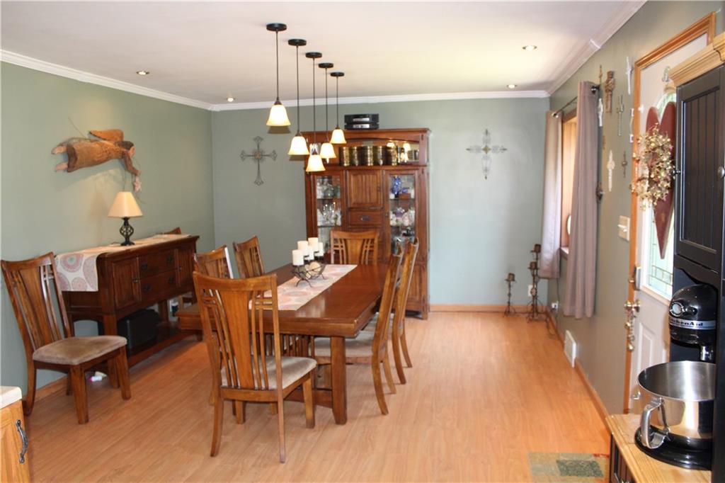 1957 Brodhead Road Aliquippa, PA 15001 - Photo 5 of 19 Dining room offer space for large table and extra pieces plus room for more. Bay window, recessed lighting and drop lighting, offers warmth to this dining room for all seasons. Crown molding, flooring and baseboards have also been updated.