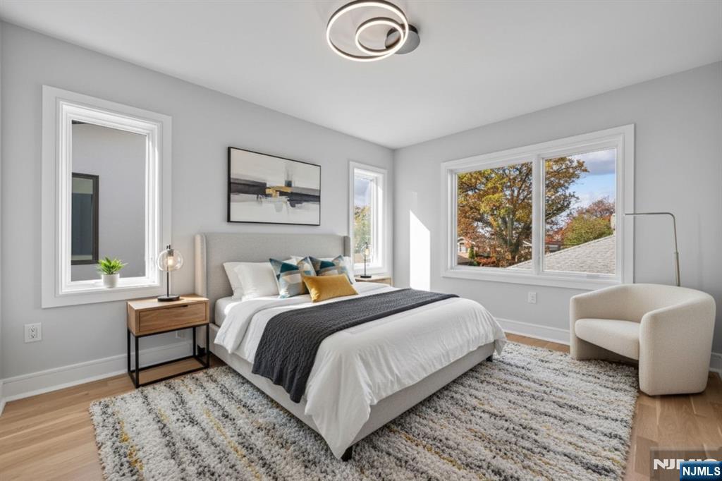 2449 Camner Street Fort Lee, NJ 07024 - Photo 30 of 47 a bedroom with a bed and a window